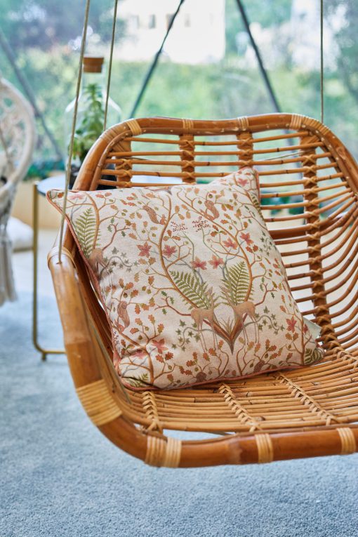 A WOODLAND TRAIL LINEN CUSHION CHAIR